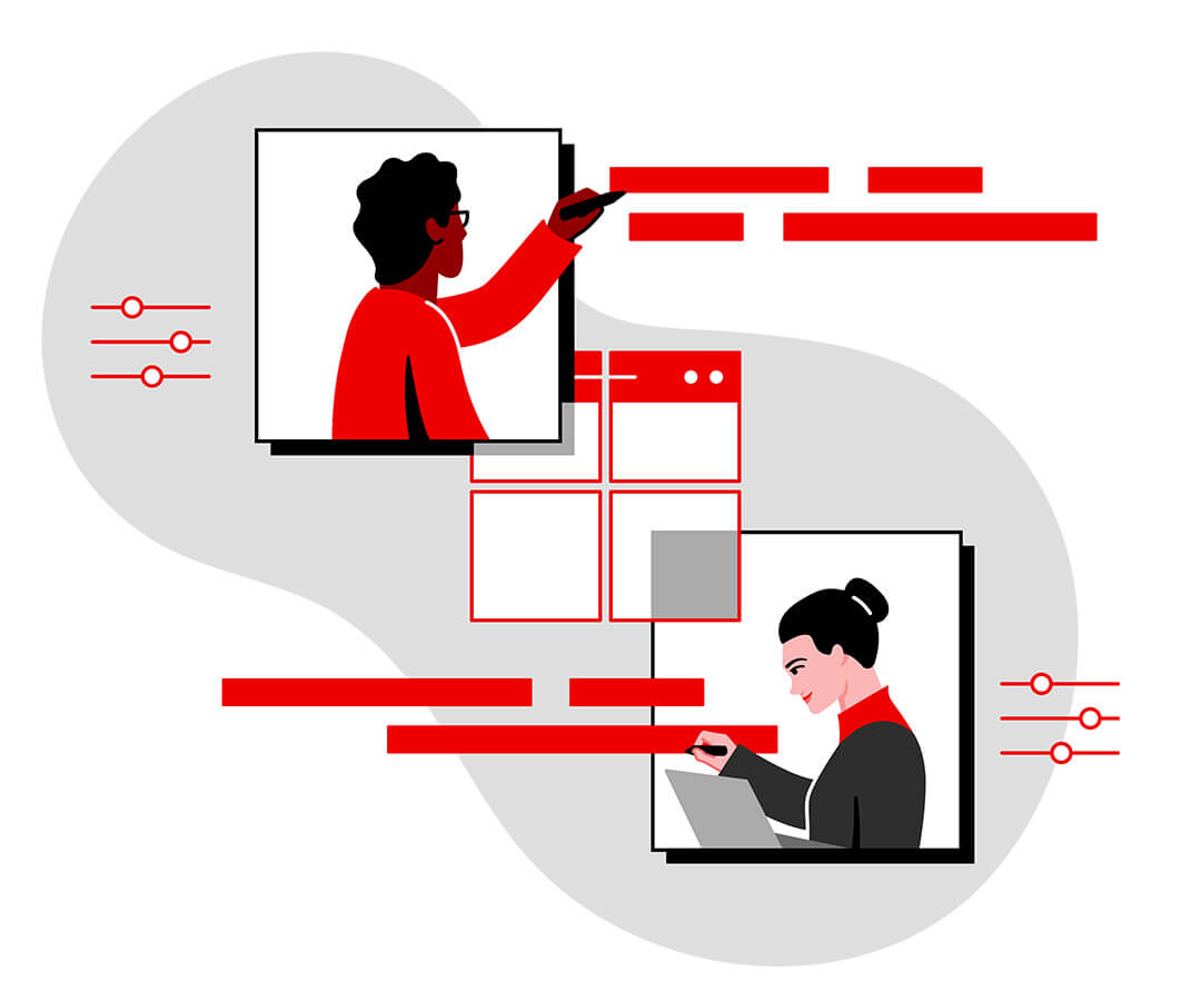 Person working at laptop while another person whiteboards 