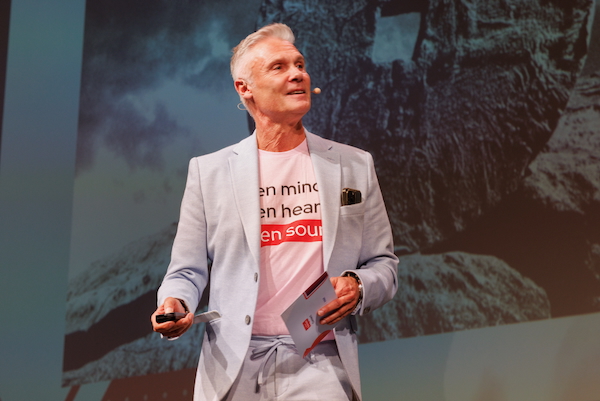 Speaker on stage at Red Hat Summit Connect Brussels 2025