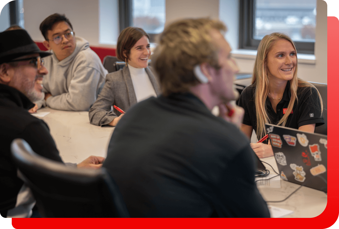 A diverse group of colleagues collaborates in a meeting