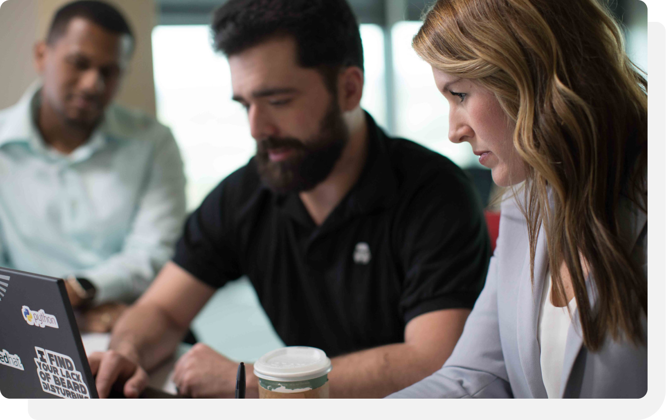 Colleagues focused on laptop