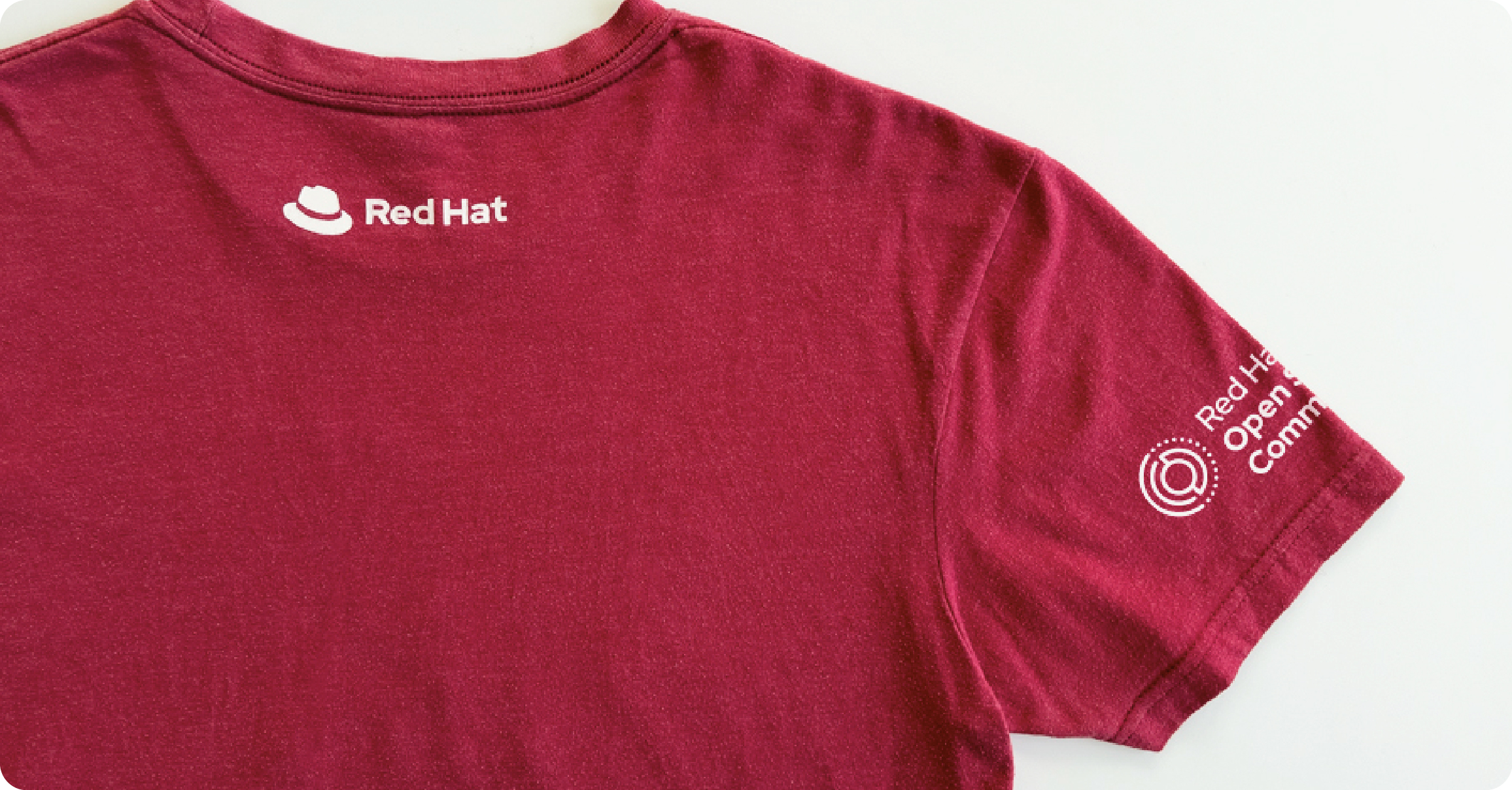 T-shirt with both the Red Hat logo and the Red Hat Open Studio Community initiative logo.
