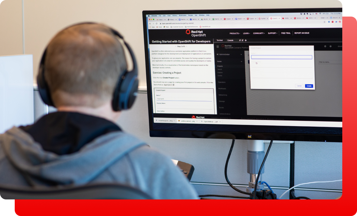 man in headset working on computer