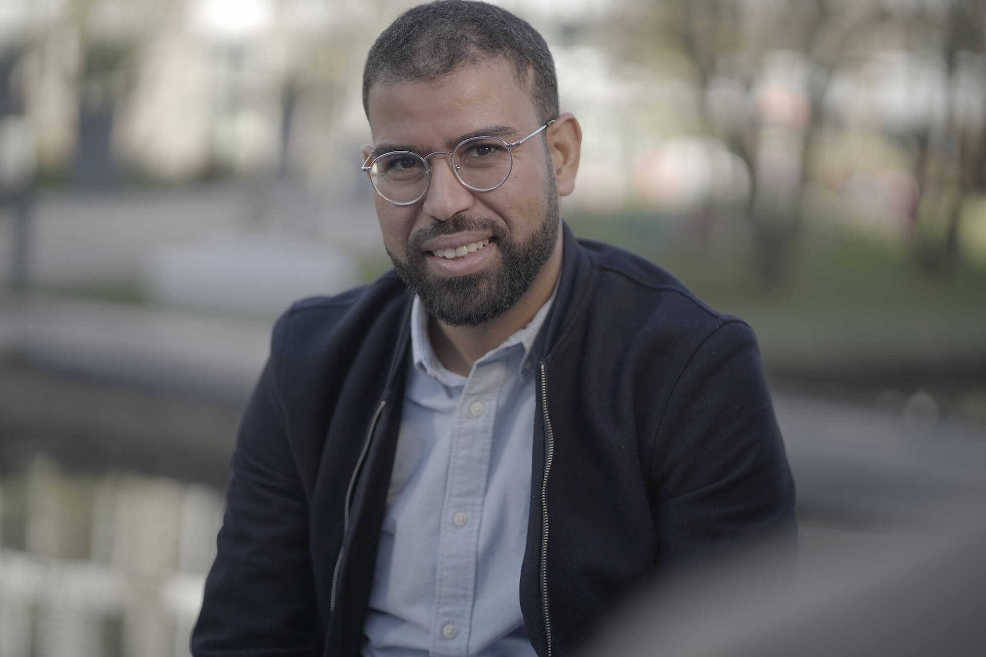 Firas Benbelgacem sitting and looking at the camera