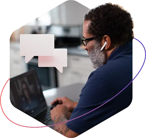 Man wearing airpods works at laptop with conversation bubbles overlaid