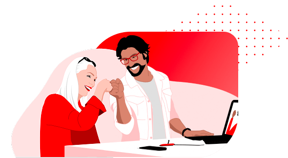 Two colleagues smiling and fist-bumping in celebration at their desk