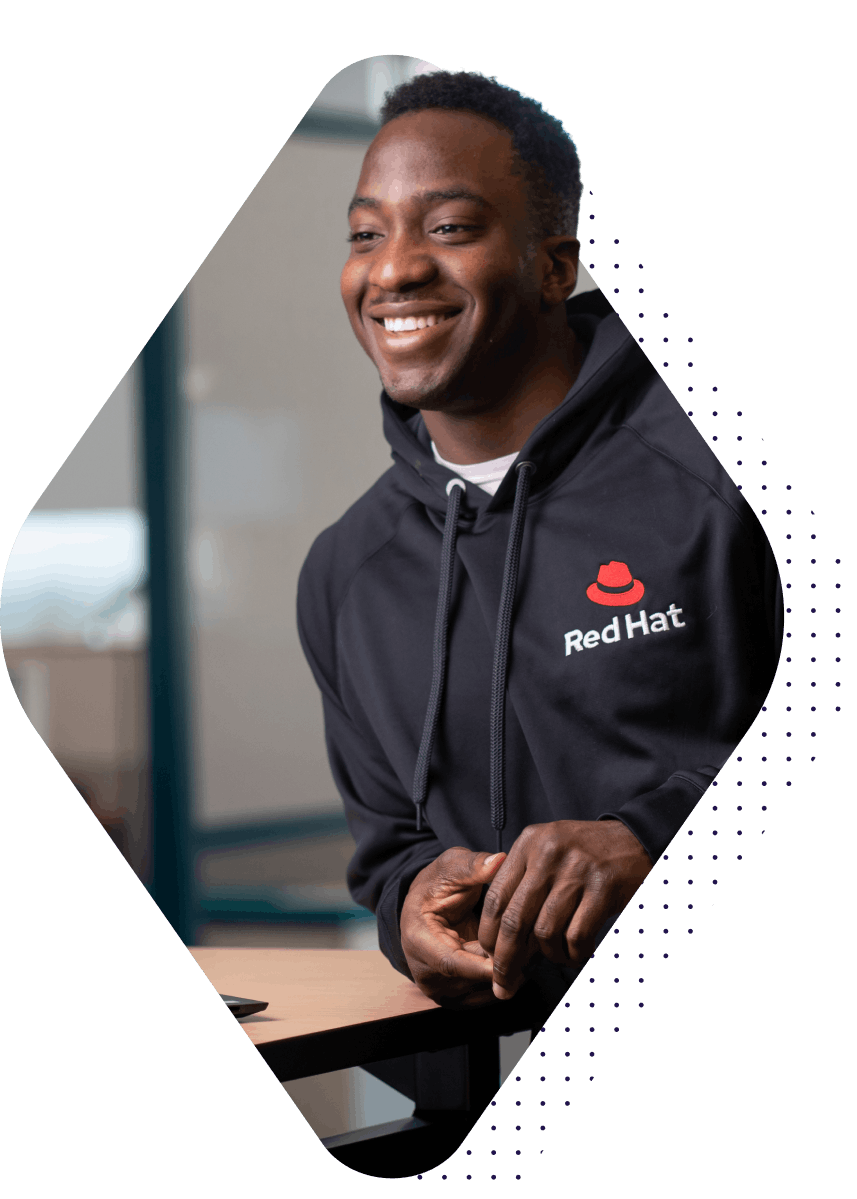 Man in Red Hat hoodie smiling