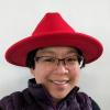 Ju Lim wearing a Red fedora