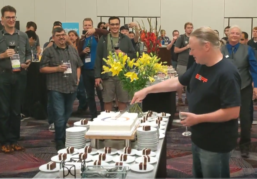 ASF Founder Brian Behlendorf cuts the ceremonial 20-year birthday cake at this year