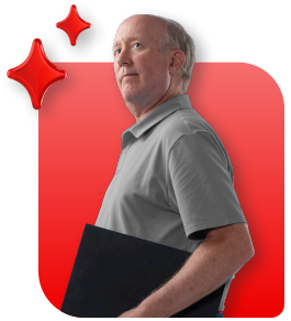 Person in gray shirt, standing, holding a laptop with two stylized floating red stars