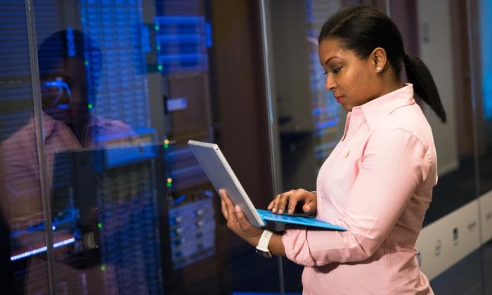 Woman monitoring data center systems