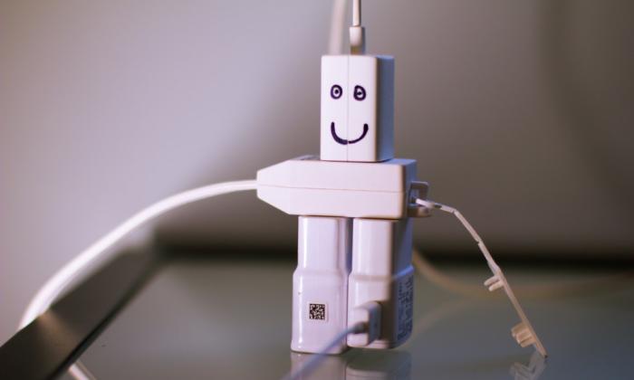 Plugs in an extension cord that look like a smiling robot